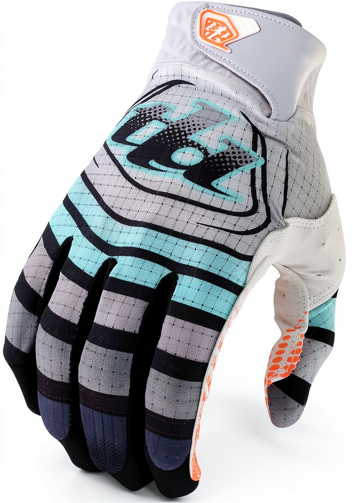 Installing Troy Lee Designs Youth Motorcycle Gloves on a wooden desk